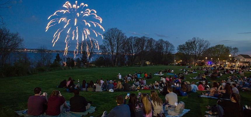 Students on campus watching fireworks